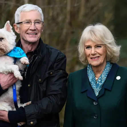 Britain's Camilla, Duchess of Cornwall (R) poses with Battersea Ambassador, Paul O’Grady during her visit to Battersea Brand Hatch Centre on February 2, 2022 in Ash as part of a visit in Kent. Stuart C. Wilson / POOL / AFP