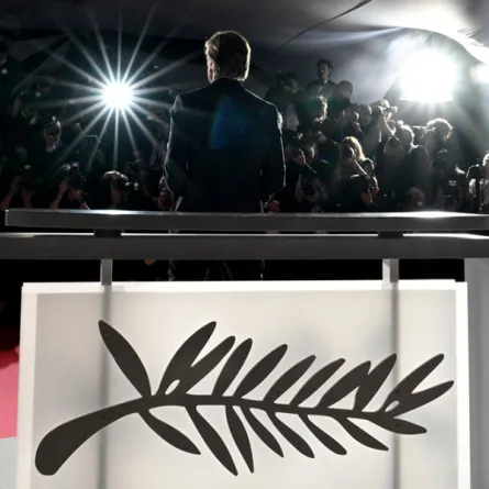 Swedish film director and screenwriter Ruben Ostlund poses with the trophy during a photocall after he won the Palme d'Or for the film "Triangle of Sadness" during the closing ceremony of the 75th edition of the Cannes Film Festival in Cannes, southern France, on May 28, 2022. LOIC VENANCE / AFP