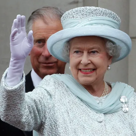  Queen Elizabeth II waves from the balcony of Buckingham Palace as Prince Charles, Prince of Wales looks on, during the finale of the Queen's Diamond Jubilee celebrations on June 5, 2012 in London, England.(Photo by Stefan Wermuth - WPA Pool/Getty Images)