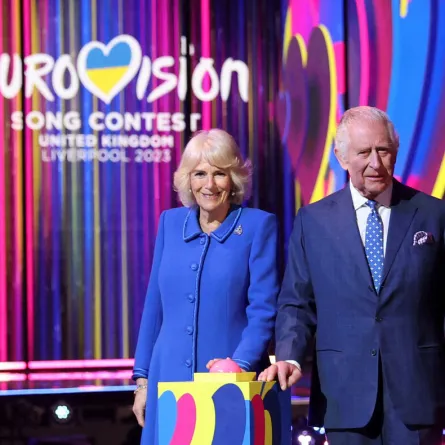 King Charles III and Britain's Camilla, Queen Consort switch on the stage lighting as they visit the host venue of this year's Eurovision Song Contest, the M&S Bank Arena in Liverpool, on April 26, 2023. PHIL NOBLE / POOL / AFP