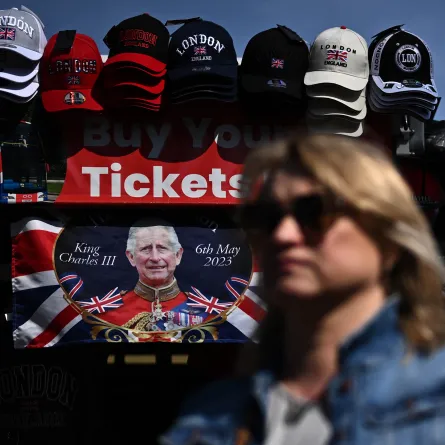 A Coronation-themed Union flag is pictured at a souvenir stall near Houses of Parliament in central London, on May 3, 2023, as preparations continue ahead of the May 6 Coronation of King Charles III. Ben Stansall / AFP