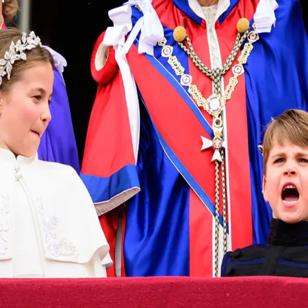 Princess Charlotte of Wales and Britain's Prince Louis of Wales stand on the Buckingham Palace balcony as they wait for the Royal Air Force fly-past in central London on May 6, 2023, after the coronations of King Charles III and Queen Camilla. Leon Neal / POOL / AFP