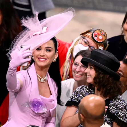 Katy Perry takes selfie photos with guests at Westminster Abbey in central London on May 6, 2023. Gareth Cattermole