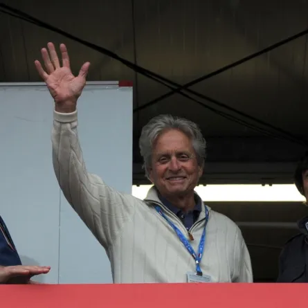 Micheal Douglas waves in Monte Carlo on May 25, 2013. AFP PHOTO / BORIS HORVAT (Photo by BORIS HORVAT / AFP)