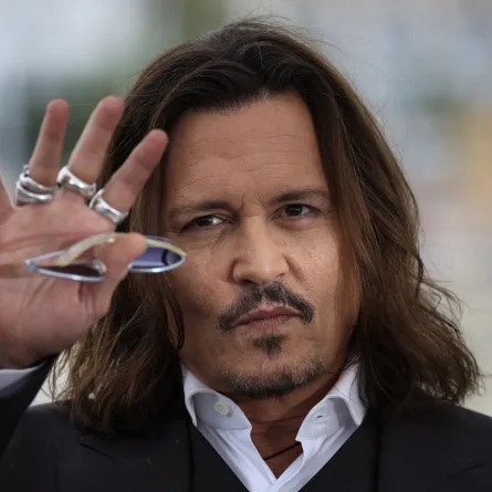 US actor Johnny Depp gestures as he poses during a photocall for the film "Jeanne Du Barry" during the 76th edition of the Cannes Film Festival in Cannes, southern France, on May 17, 2023. (Photo by Valery HACHE / AFP)