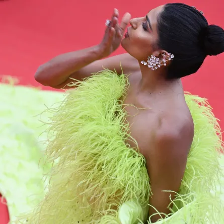 Indian influencer Farhana Bodi blowss kisses as she arrives for the opening ceremony and the screening of the film "Jeanne du Barry" during the 76th edition of the Cannes Film Festival in Cannes, southern France, on May 16, 2023. (Photo by Antonin THUILLIER / AFP)