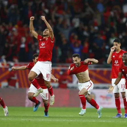 African Super Cup - Final - Al Ahly SC v Raja Casablanca - Ahmed bin Ali Stadium, Al Rayyan, Qatar - December 22, 2021 Al Ahly's Mohamed Sherif and teammates celebrate after winning the penalty shoot-out REUTERS/Amr Abdallah Dalsh - أرشيفية من رويترز