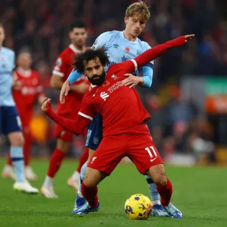 Soccer Football - Premier League - Liverpool v Brentford - Anfield, Liverpool, Britain - November 12, 2023 Liverpool's Mohamed Salah in action with Brentford's Mads Roerslev REUTERS/Molly Darlington 
