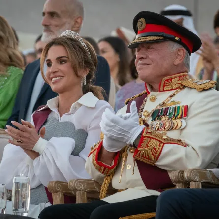 الملك عبدالله الثاني والملكة رانيا خلال حضورهما فعاليات يوم الجلوسJordan's King Abdullah II and Queen Rania attending the Silver Jubilee ceremony in Amman (مصدر الصورة:  Chris Setian / Jordanian Royal Palace / AFP)