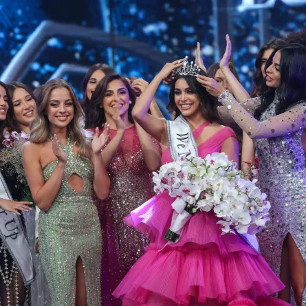 Miss Lebanon 2022 Yasmina Zaytoun is crowned by Miss Lebanon 2018 Maya Reaidy at the Forum de Beyrouth in the capital Beirut, on July 24, 2022. (Photo by ANWAR AMRO / AFP)