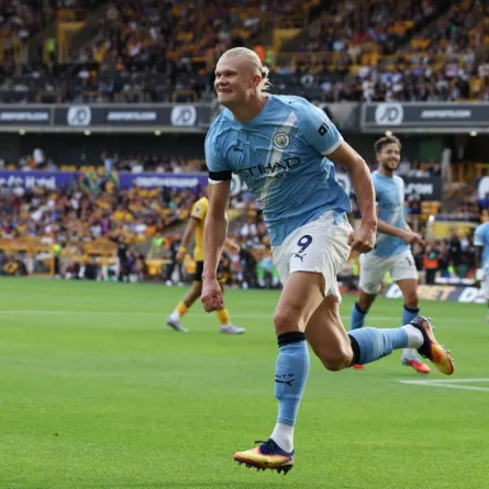 Erling Haaland celebrates scoring their third goal during the English Premier League football match between Wolverhampton Wanderers and Manchester City at the Molineux stadium in Wolverhampton, central England on August 16, 2025. (Photo by Darren Staples / AFP)