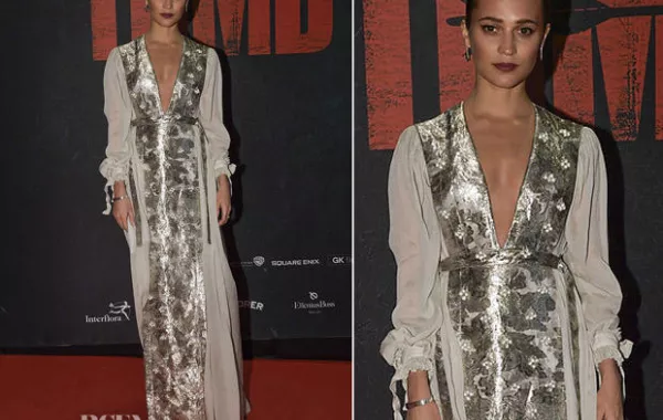 Alicia Vikander تتألق بفستان حرير من Louis Vuitton