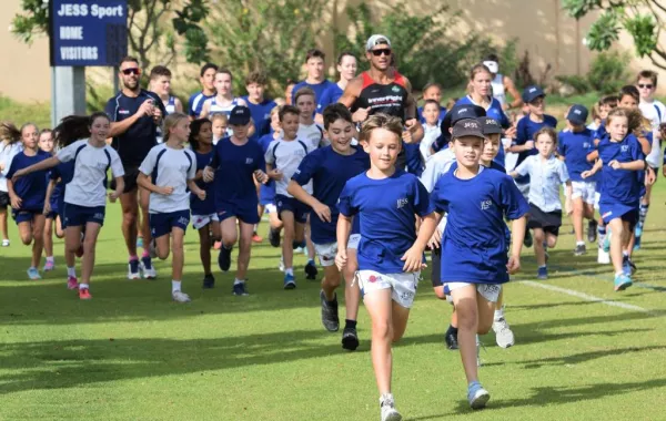 JESS students with DFC Marathon Man.jpg