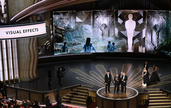 Richard Baneham (C) accepts the Oscar for Best Visual Effects for "Avatar: The Way of Water" onstage during the 95th Annual Academy Awards at the Dolby Theatre in Hollywood, California on March 12, 2023. Patrick T. Fallon / AFP