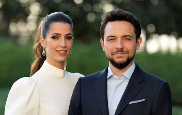 ولي العهد الحسين بن عبدالله الثاني والأميرة رجوة الحسين- مصدر الصورة: Jordanian Royal Palace / AFP