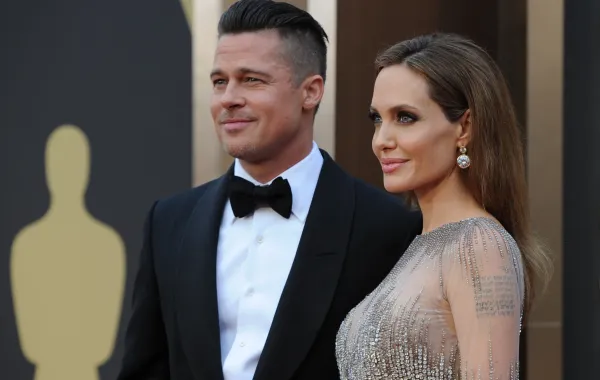 براد بيت Brad Pitt وأنجلينا جولي Angelina Jolie في حفل توزيع جوائز الأوسكار الـ 86. مصدر الصورة من ROBYN BECK / AFP