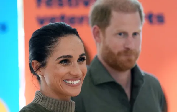 الأمير هاري (Prince Harry) وزوجته ميغان ماركل (Meghan Markle)- Photo by Jonathan Brady / POOL / AFP