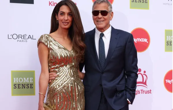 جورج كلوني George Clooney وأمل كلوني Amal Clooney في قاعة رويال ألبرت بلندن. مصدر الصورة: Adrian Dennis / AFP