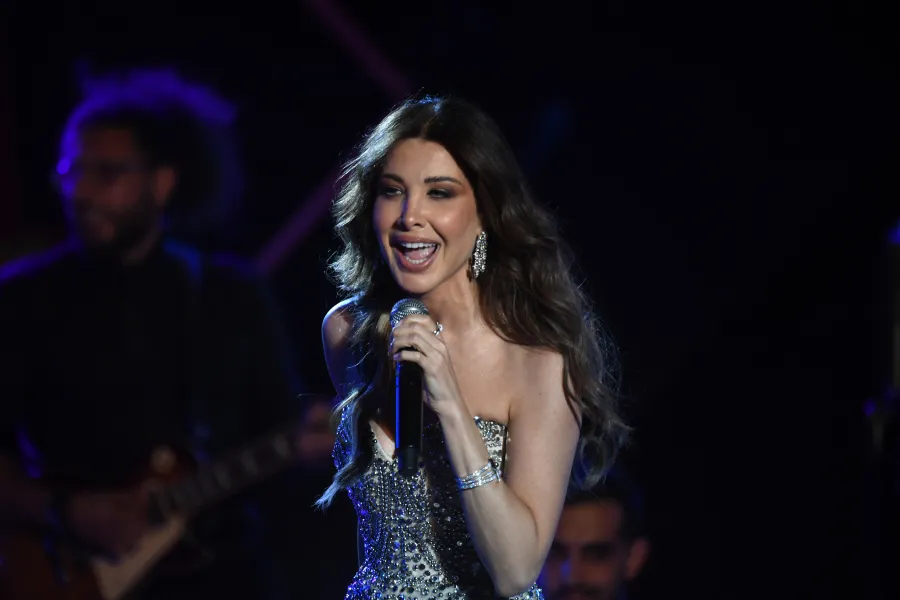  Nancy Ajram performs during the 59th edition of the Carthage International Festival at the Roman Theatre in Carthage in Tunis.  نانسي عجرم تحيي حفلًا غنائيًا خلال الدورة التاسعة والخمسين من مهرجان قرطاج الدولي على المسرح الروماني في قرطاج بتونس. مصدر الصورة: (Photo by FETHI BELAID / AFP)