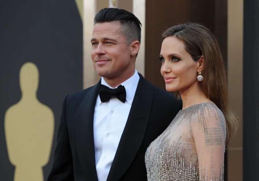 براد بيت Brad Pitt وأنجلينا جولي Angelina Jolie في حفل توزيع جوائز الأوسكار الـ 86. مصدر الصورة من ROBYN BECK / AFP